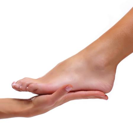 Foot of a female foot lays on a palm